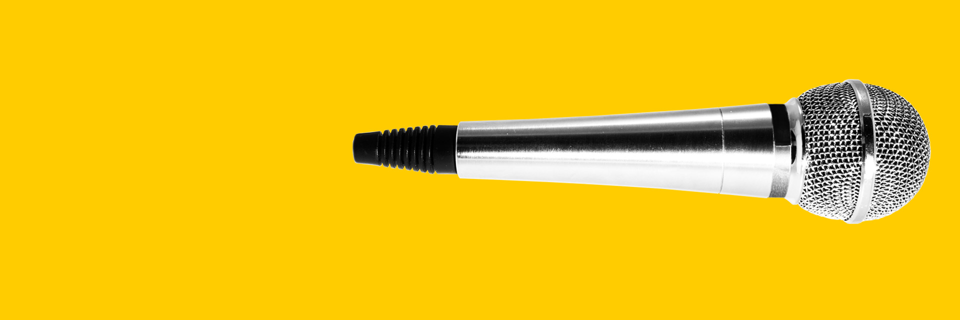 Horizontal Silver microphone with yellow background