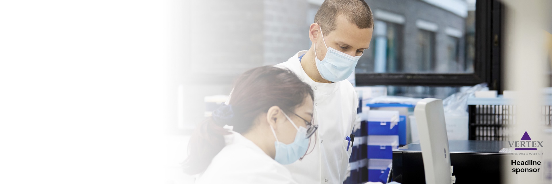 Banner image showing two researchers in a lab