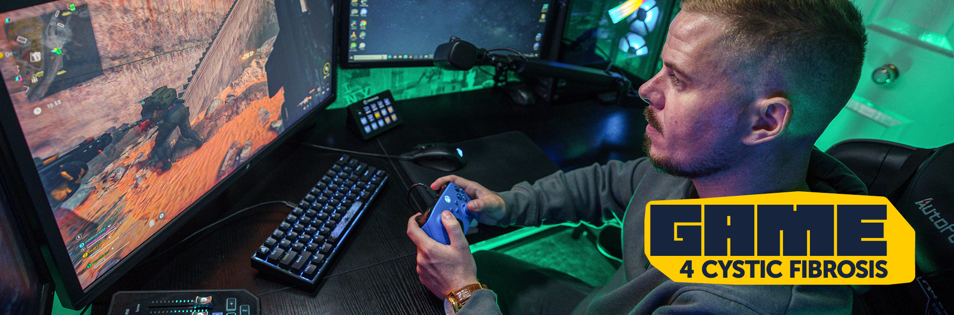 Man at gaming station holding controller