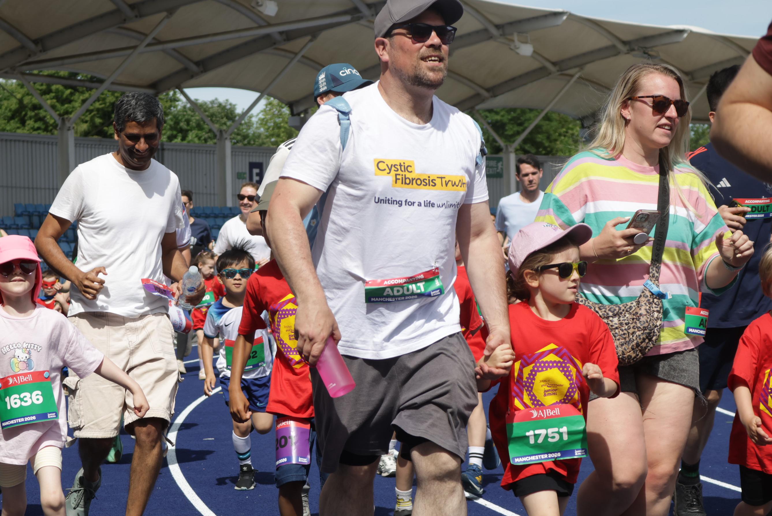 a father and daughter getting ready to run a race