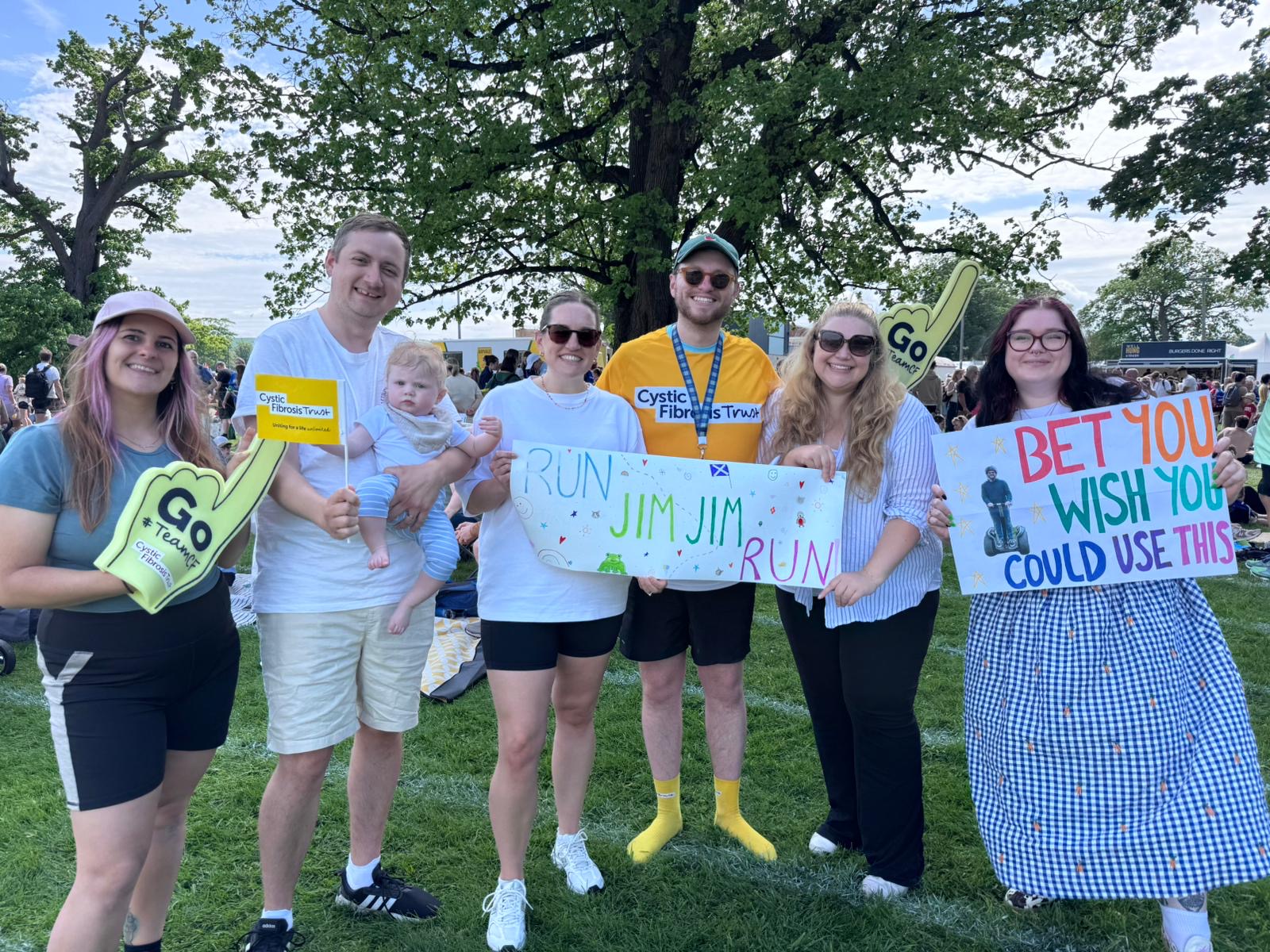 a group of people holding motivational running signs