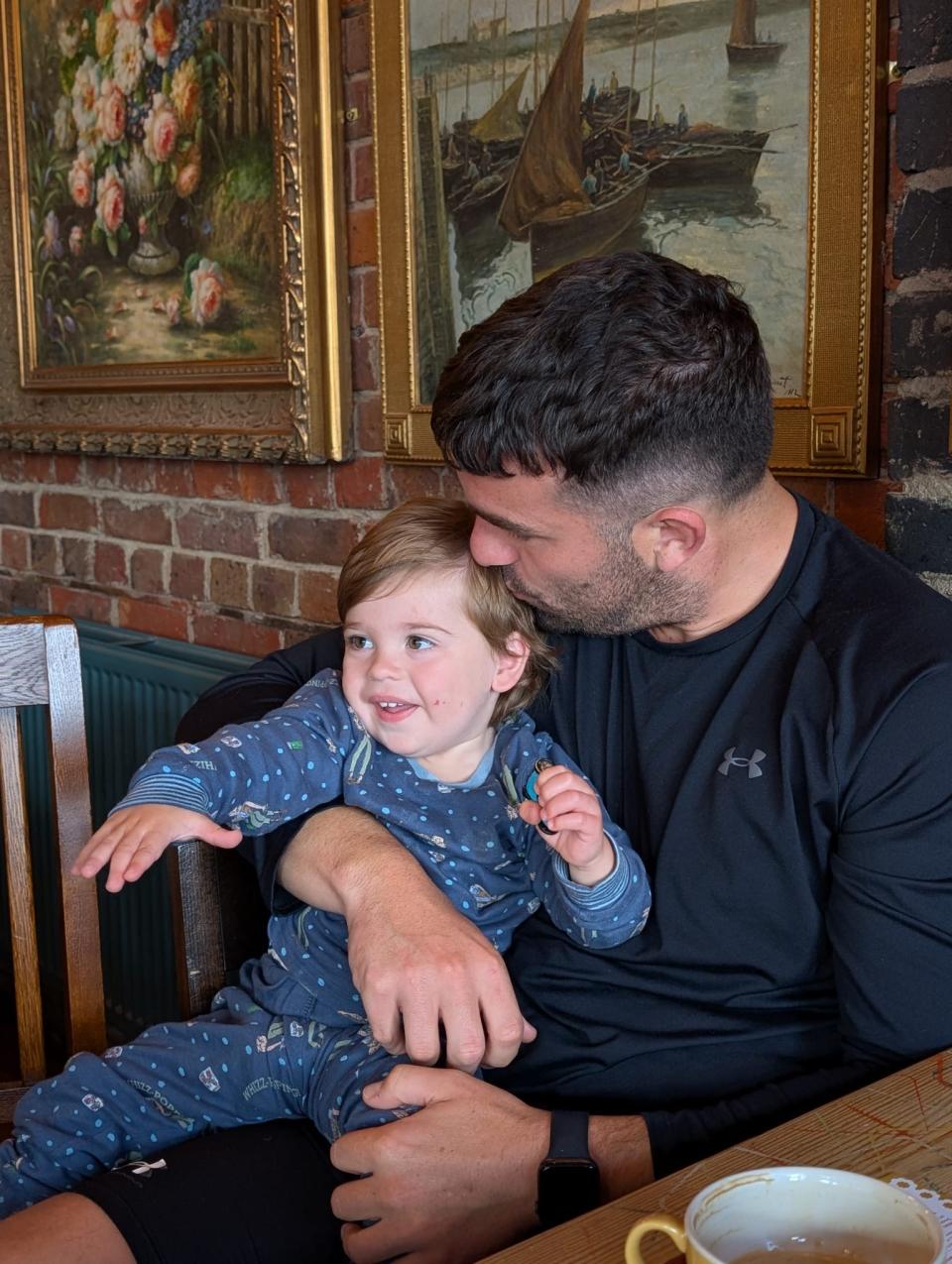 Max holding his son Navy