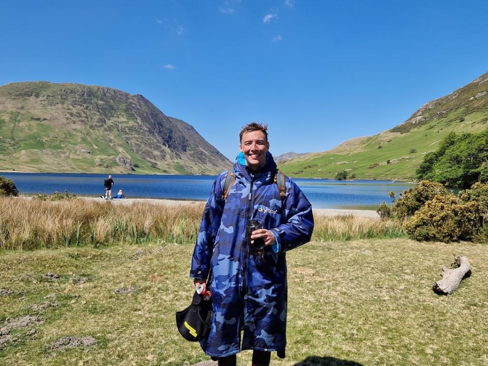 Adam standing near the lakes