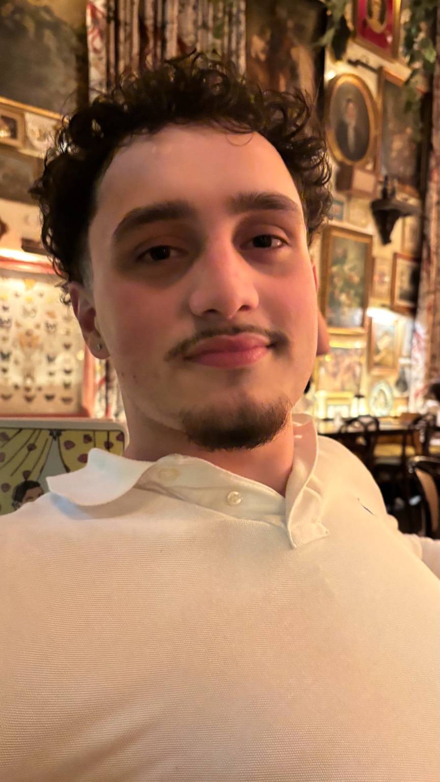 Adam sitting at a table