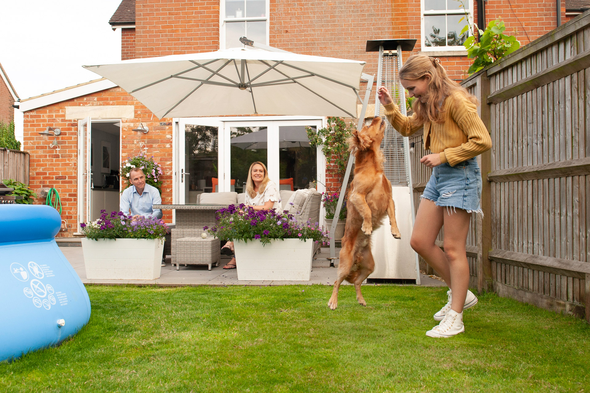 Tilly in the garden, playing with her dog