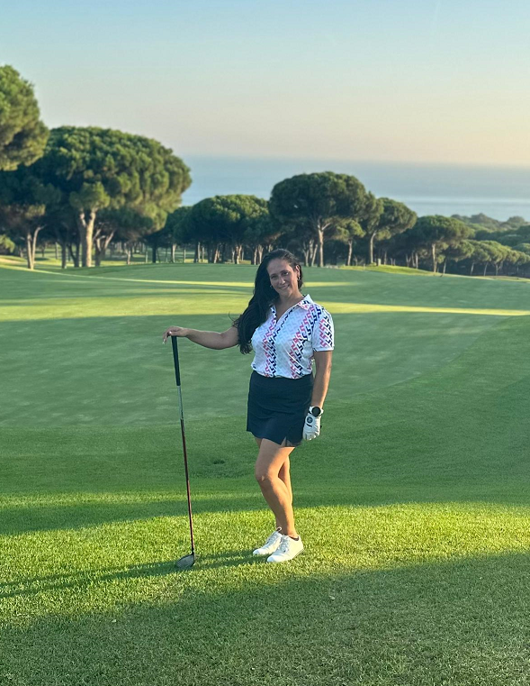 Image of Ana golfing