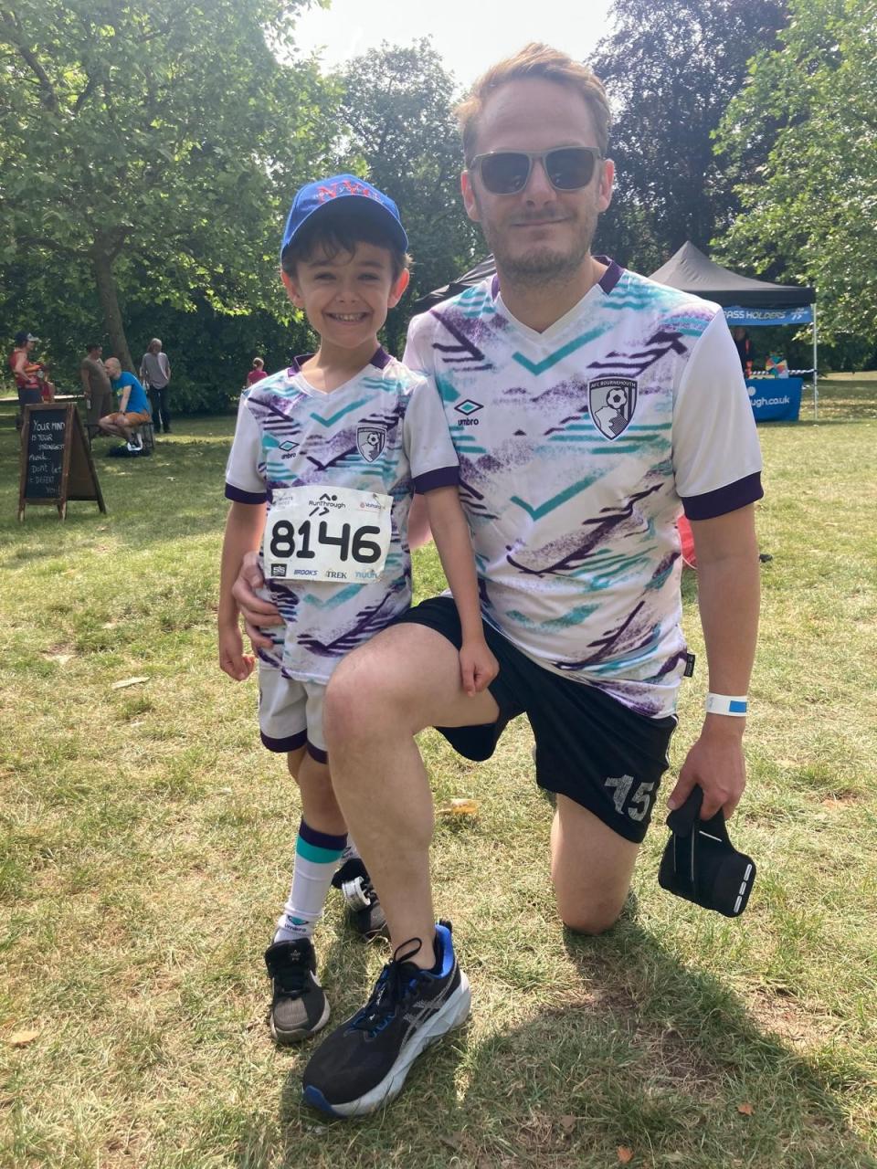 Carl and Nicholas both wear football shirts. Nicholas wears his dad's running number