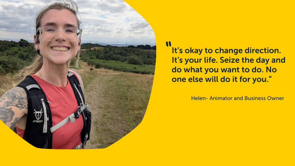 Image of Helen, smiling to the camera. She has glasses and a back-pack on. She is in a field.  