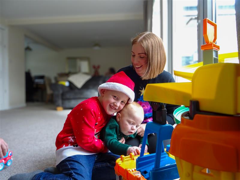 Rebecca, Marcus and Zander playing with toys