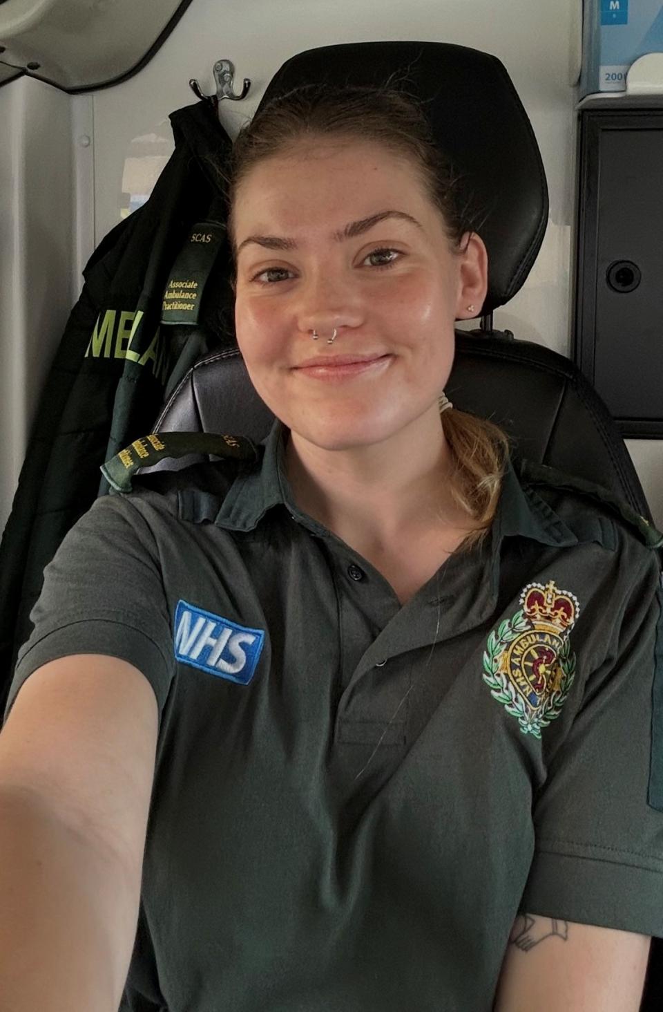 Orla in an ambulance, dressed in uniform