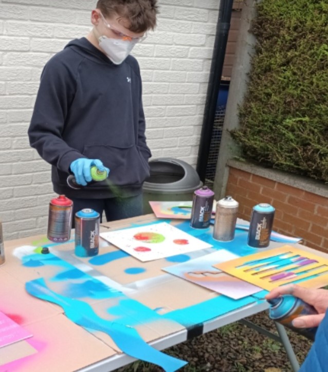 boy spray painting