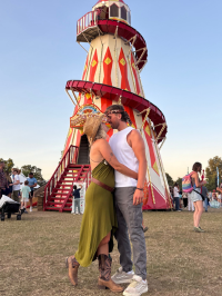 Nicole and Matthew standing in front of a helter skelter