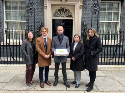 Cystic Fibrosis Trust Staff handing in the petition