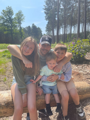 Parker with his dad and siblings
