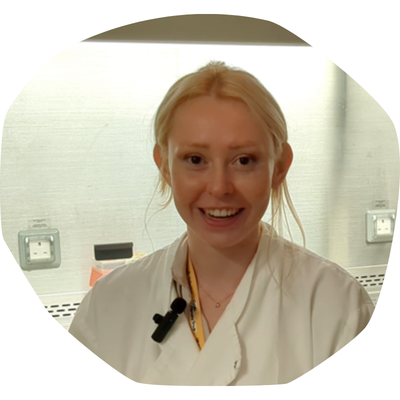 Issie Rose, in her white coat in a lab