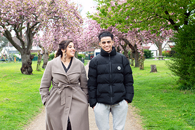 Kareem and Yasmin walking in park