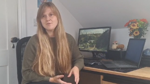 Photo of Emily at computer