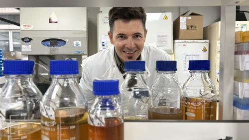 Photo of Dr Luke Allsopp in the lab