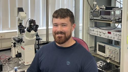 Photo of James in the lab