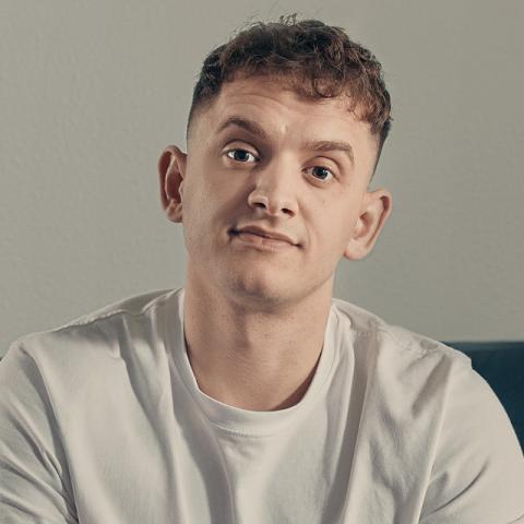 kieron sitting looking at camera