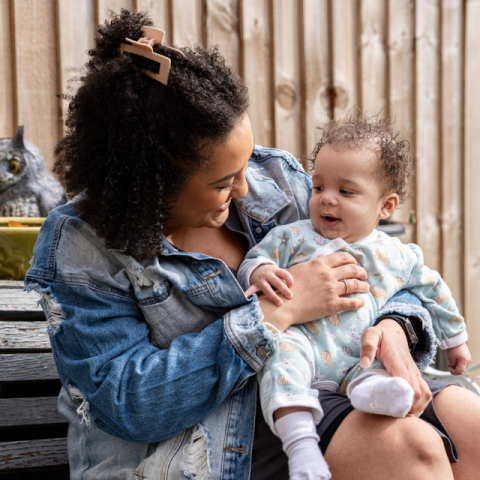 Shanique holding baby Thiago, who has CF