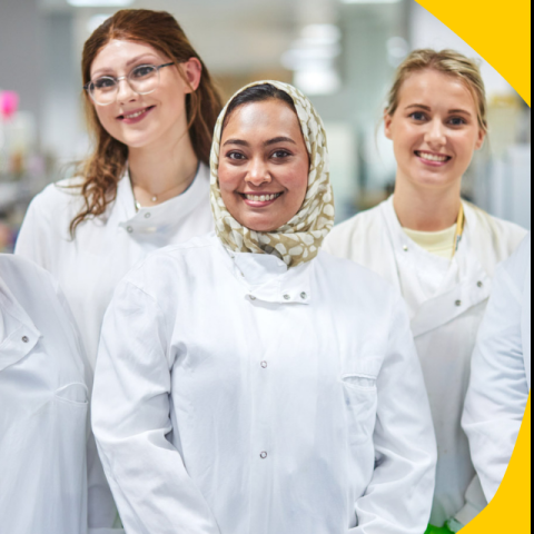 a group of scientists in lab coats