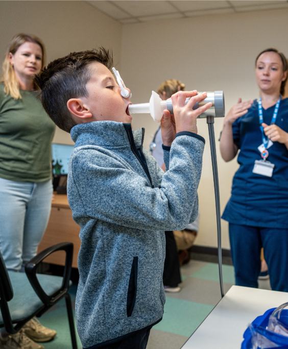 boy doing lung test