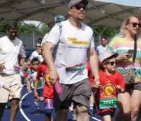 a father and daughter getting ready to run a race