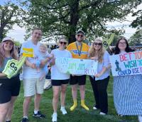 a group of people holding motivational running signs