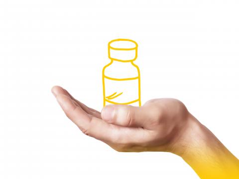 Hand holding an illustrated bottle of medicine