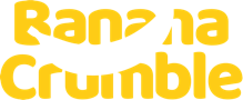 A logo with the words 'banana crumble' in yellow on a white background. A white banana shape is cut out of the middle of the words.