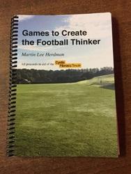 A photograph of a wire-bound book. The book has an image of a green field and blue skies on it and the words 'Games to Create the Football Thinker' and 'Martin Lee Herdman' on it.