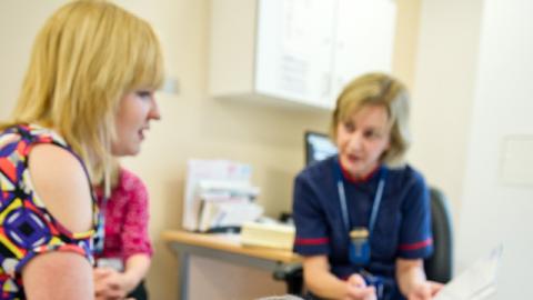 Nurse discussing with CF patient