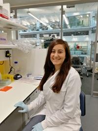 PhD student and CF's Got Talent 2018 winner Afroditi Avgerinou in the lab wearing a lab coat