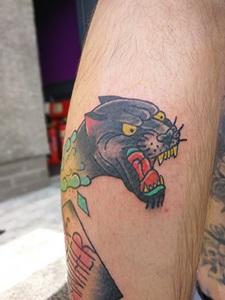 Callum's tattoo of a black panther baring its teeth
