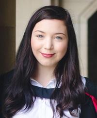 young woman wearing graduation gown