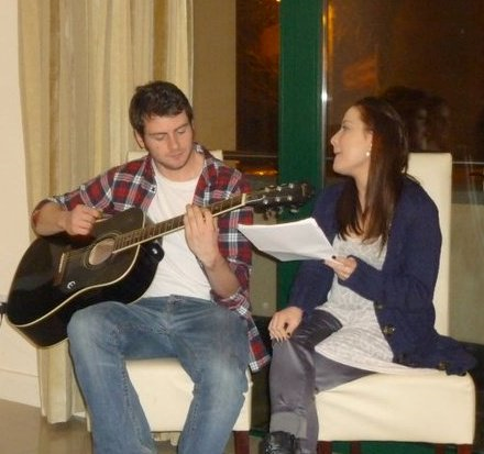Bianca and Gearoid singing and playing guitar together