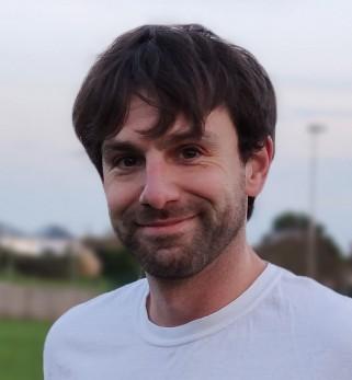 Young white man smiling at the camera