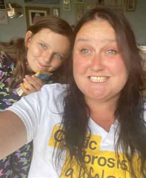 Selfie of mum with daughter. Mum is wearing a Cystic Fibrosis Trust t-shirt