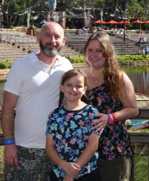 Happy family with mum, dad and daughter