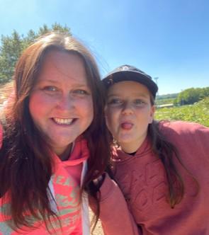 Mum and daughter outside on a sunny day