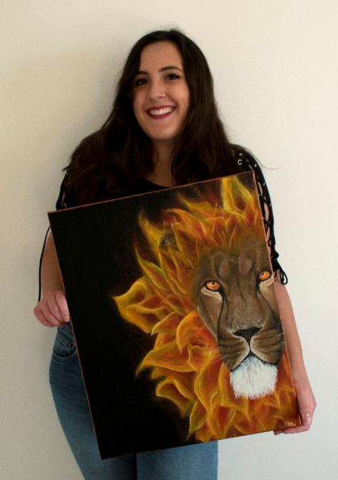 Ellie Helen Barrett Bright Idea Award winner with painting of lion