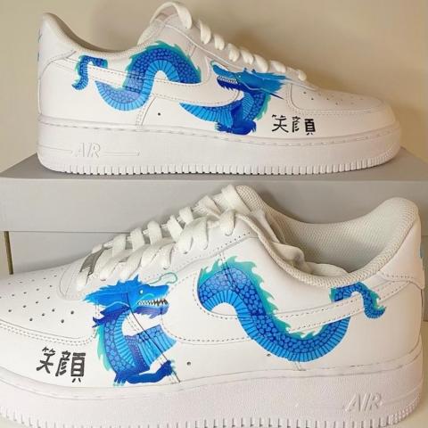 Emily's Helen Barrett Bright Idea award customised trainers white nikes with blue dragons drawn around the tick