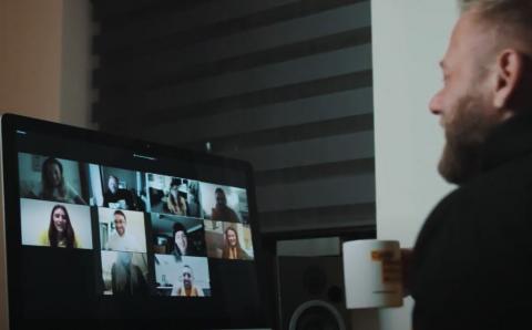 Man on a video call with multiple participants