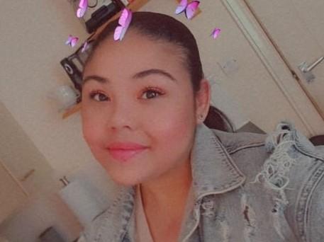 Picture of Nubi wearing denim jacket taking a selfie
