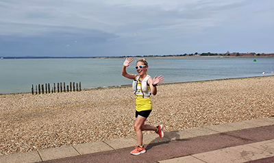 Robyn running on the beach
