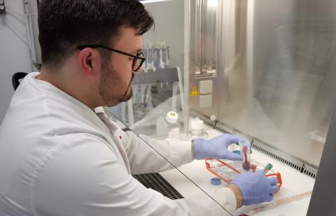Photo of Elliot working in the lab