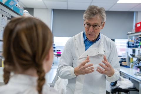 Photo of Professor Jim Shaw talking to Eilidh