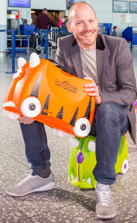 Rob holding Trunki at airport