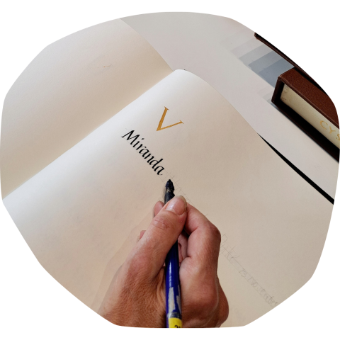 calligrapher writes in the Book of Remembrance